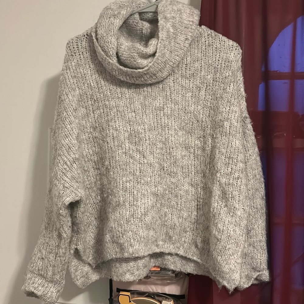 Soft knitted light gray loose neck sweater
